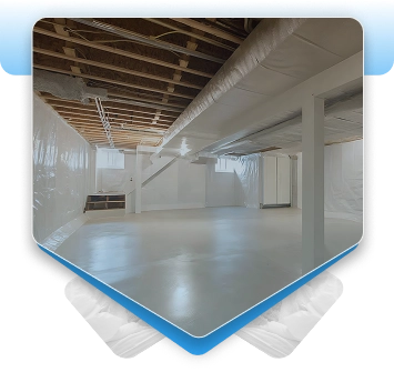 Clean waterproofed basement with white wall liners and exposed ceiling.