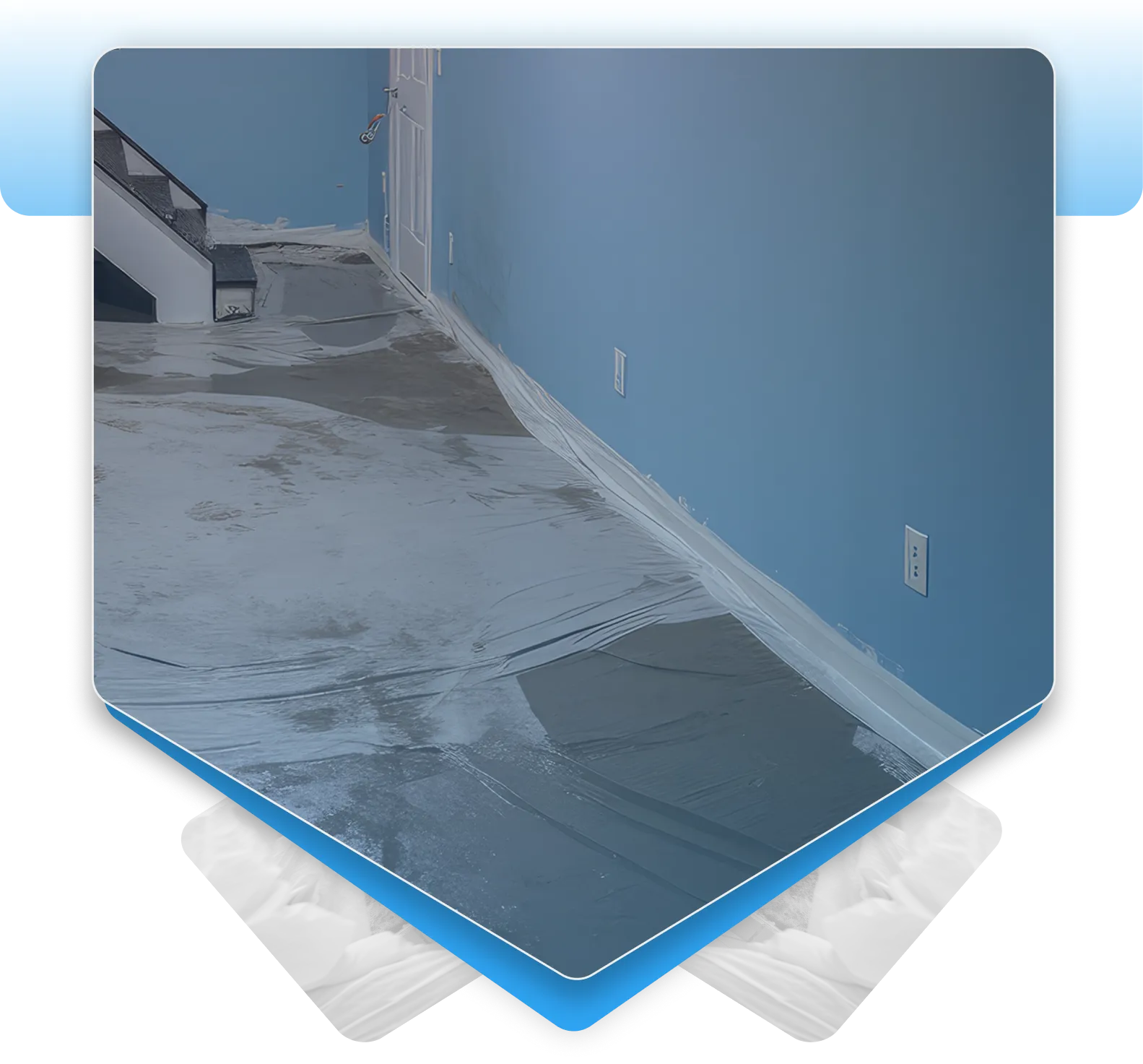Residential basement floor undergoing concrete sealing and waterproofing treatment.