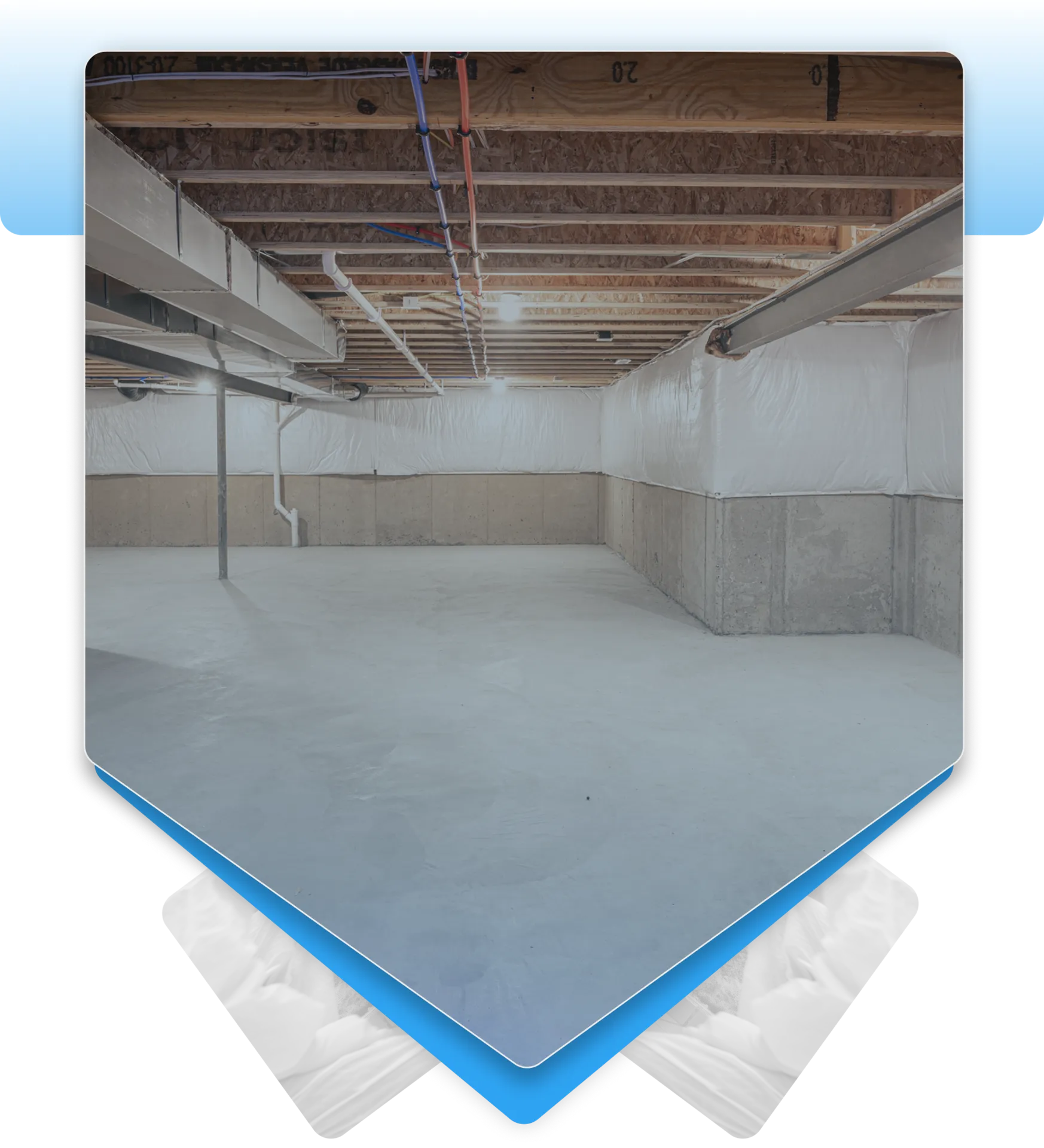 Clean unfinished basement with white wall liners and concrete floor.